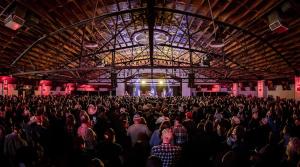 a large crowd of people sitting in a building at Modern King Bed 5 mins to Downtown in Tulsa +52 photos