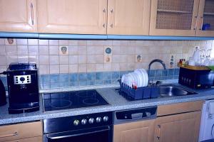 a kitchen counter with a sink and a stove at Holiday Rhein 3 in Boppard