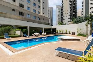 a swimming pool in the middle of a building at #TW1301 | ZER01 Suítes |Flat em Hotel Vila Olimpia in Sao Paulo