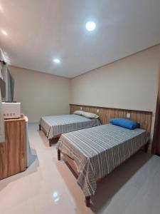 En eller flere senge i et værelse på Apartamento no centro da cidade