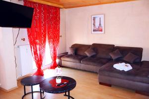 a living room with a couch and a table at Holiday Rhein 4 in Boppard +13 photos