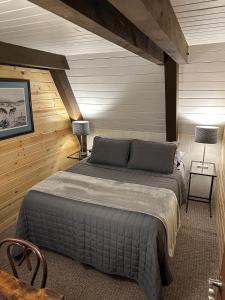 a bedroom with a large bed in a room at Rocky Pines UP in Bessemer