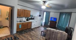 a living room with a kitchen and a couch at K2 Affordable 2nd Floor 1BR Near MTU w Keweenaw Fun 