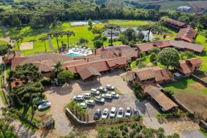 an aerial view of a house with a parking lot at Boqueirão Hotel Fazenda in Lages