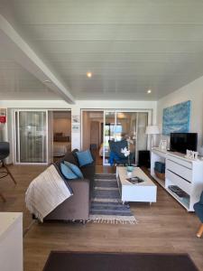 a living room with a couch and a table at Villa Matilde e Joaquim in Porto da Cruz +53 photos