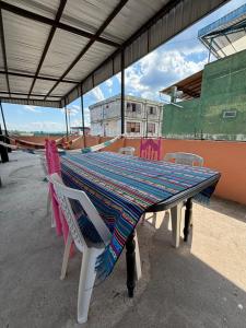 a table with a table cloth on top at casa del sol in Tena