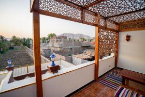 a view from the balcony of a house at The Village House with Private Garden - Four Bedroom Nubian Home on Luxor West Bank in Luxor