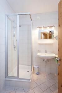 a bathroom with a shower and a sink at Ferienhaus Auer in Nauders