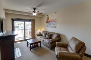 a living room with a couch and a table at Chase On The Lake in Walker