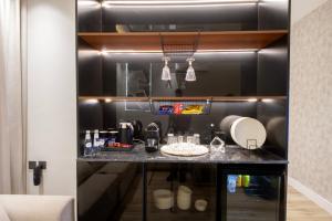 a kitchen with black walls and a counter at شقق سكنة الرياض in Quai +41 photos