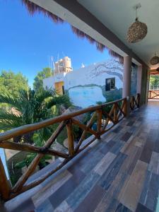 a room with a balcony with a view at Jungla maya hotel in Bacalar