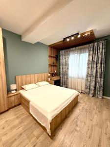 Ένα ή περισσότερα κρεβάτια σε δωμάτιο στο Sunset Park Apartment