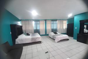 Postel nebo postele na pokoji v ubytování Departamento Acosta 2