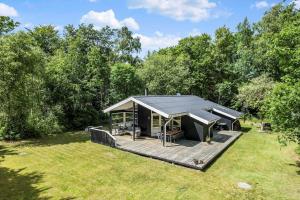 a gazebo with a deck in a yard at OH185-Hadsund-Sommerland-39 in Hadsund
