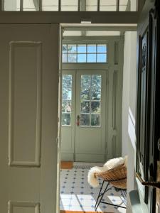 a door in a room with a tile floor at Design Villa Uckermark mit riesigem Garten in Ferdinandshof