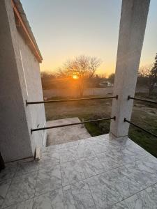 a view of the sunset from the outside of a building at Solares de Sabatini in Villa del Totoral