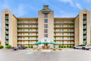 an exterior view of a hotel with a parking lot at River Hideout in Pigeon Forge