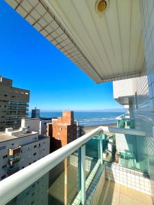 a view of the ocean from the balcony of a building at Cobertura Vista Mar com Piscina Privativa - PG in Praia Grande +13 photos