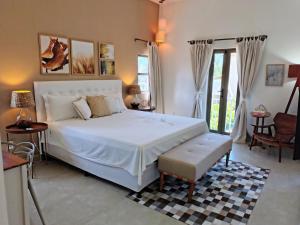 Ένα ή περισσότερα κρεβάτια σε δωμάτιο στο Villa Brama Mare - 4 suítes, piscina, sala de jogos