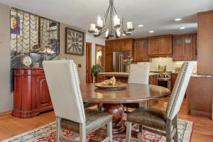 a kitchen with a dining room table and chairs at Luxury Home with Private Hot Tub, Woodburning Fireplace, Pet Friendly in Vail