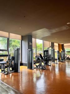 a gym with a lot of treadmills and chairs at Radiance Manila Bay Bayview Comfort with Pool & Pet-Friendly in Manila