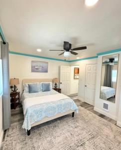 a bedroom with a bed and a ceiling fan at Beachside retreat in Santa Cruz
