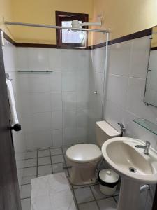 a bathroom with a toilet and a sink at Ingá Praia hotel in Natal +21 photos