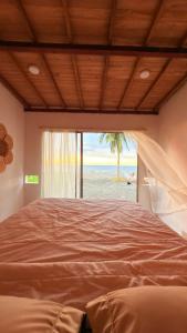 Postel nebo postele na pokoji v ubytování Casa jaguar frente al mar