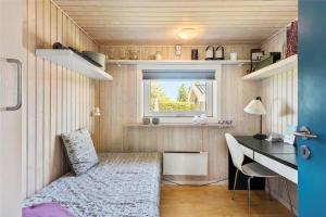 a small room with a desk and a bed in a tiny house at FY237-Otterup-Vestparken-6 in Otterup