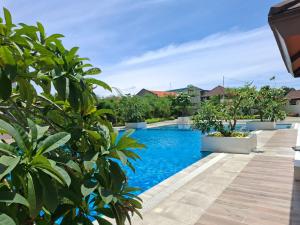 a swimming pool in a villa with plants at EuroAsian Royal Oceancrest Mactan in Sudtungan