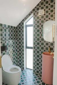 a bathroom with a toilet and a window at Great Views in the City in Auckland +30 photos