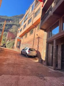 a car parked in front of a building at Family house in Ourika
