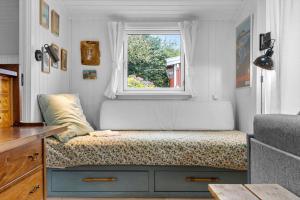 Una cama o camas en una habitación de 5586-Svaneke-Duebakken-12