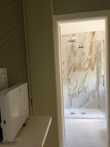 an open door of a refrigerator in a room at Facibeni Rooms con Parking in Florence