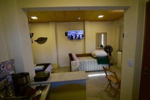 TV a/nebo společenská místnost v ubytování Hospedagem Terra de Aquários