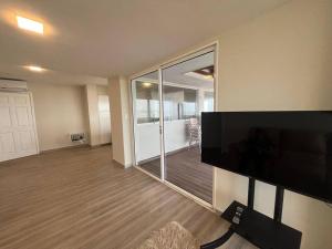 Μια τηλεόραση ή/και κέντρο ψυχαγωγίας στο Espectacular Penthouse con Terraza Privada