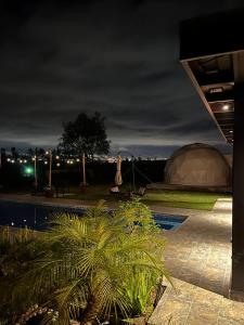a domed tent is lit up at night at Quinta Paco de Lucía in Yaruqui +7 photos