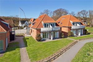 a house with orange roofs in a residential neighborhood at FY330-Kerteminde-Klintevej-45-lej-22-1-sal in Kerteminde