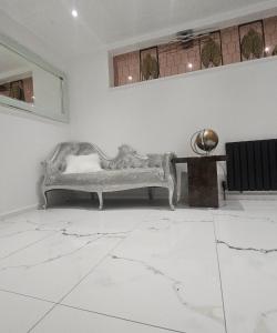 a living room with a couch and a table at Peaceful home in Moorside