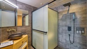 a bathroom with a sink and a shower at Kumonoue Fuji Hotel - Vacation STAY 13704v in Oishi +29 photos
