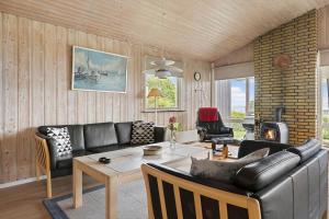 a living room with a couch and a table at 6680-Allinge-Brunekulvej-2-C in Allinge