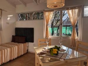 a living room with a couch and a table at La Perla in El Bolsón