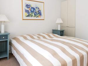 a bedroom with a bed with two night stands and two lamps at 6 person holiday home in Aabenraa-By Traum in Aabenraa +23 photos