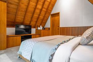 Ένα ή περισσότερα κρεβάτια σε δωμάτιο στο Amarell Ubud - Private Luxury Villa
