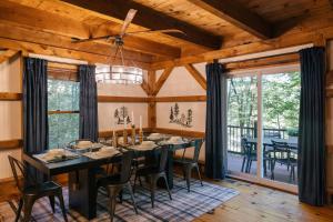 a dining room with a black table and chairs at Family Retreat Sauna Hot Tub Games Peloton in Bartlett