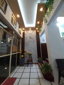 a lobby of a building with a climbing wall at Hotel Central in Latacunga