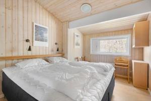 Postel nebo postele na pokoji v ubytování 2637-Nexo-Fjaelstaunijn-8