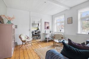 a living room with a couch and a table at 5619-Svaneke-Hans-Thygesensvej-1 in Svaneke +11 photos