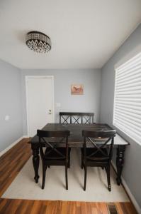 a dining room with a table and two chairs at Bright and Peaceful Apt in Midvale in Midvale +6 photos