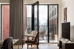 a hotel room with a view of a city at Urban Rest Dublin Docklands in Dublin